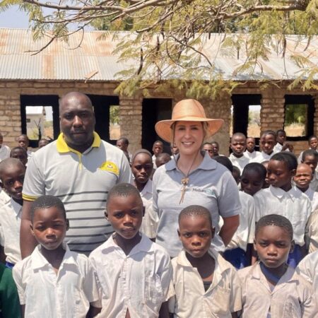 03.10.23 – Continued community engagement work in the region we operate is critical to building strong relationships with the local community.

Below, our HE1 CEO Lorna Blaisse is meeting with Deputy Headteacher and children of Mkonko village Primary School.