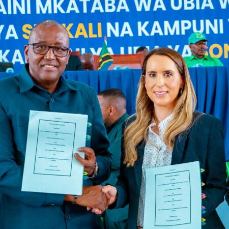 02.05.26 – Lorna Blaisse, CEO shakes hands with Dr. Steven Kiruswa, Deputy Minister of Minerals post execution of the agreements.